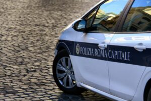 A police car, in the centre of Rome, the capital of Italy. Photo by Nick Fewings under Unsplash License