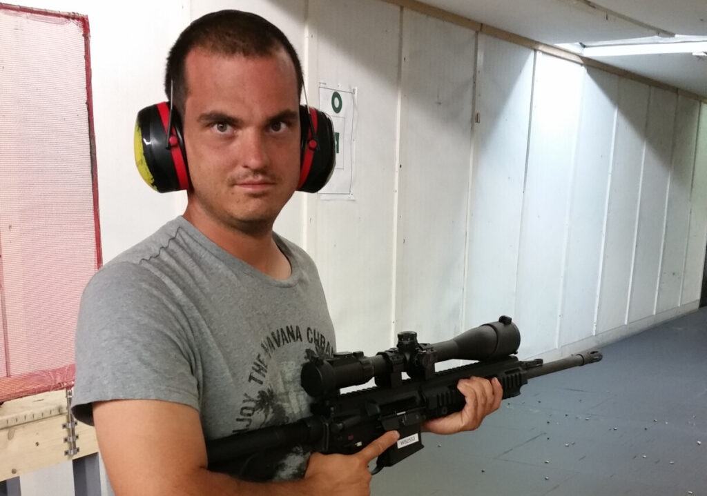 Photograph of Alexander Scheuermann with a weapon posted on social media - Photo from Exif.